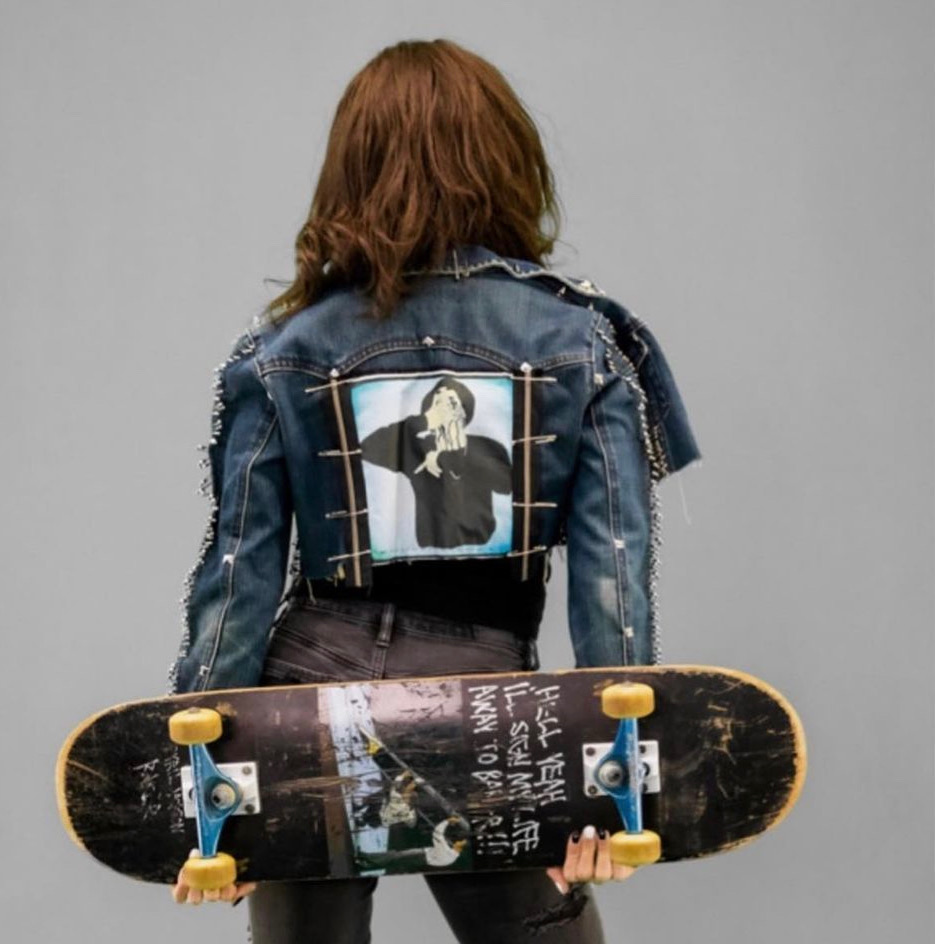 Hand-stitched denim rockstar jacket with studded shoulders